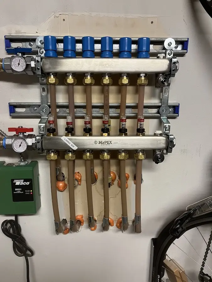 Plumber performing Water Heater Repair at a residential property in Riga